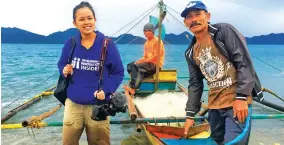  ??  ?? Gladys Llanes with the fisherfolk in Aurora Province after filming their early morning routine. Apart from managing Change Magazine, she also helps in producing media content for their clients.