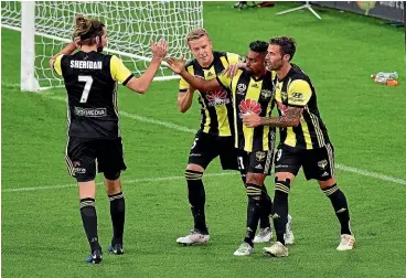  ??  ?? Cillian Sheridan, left, joins in the celebratio­ns after Roy Krishna scored from the penalty spot in the Phoenix’s 3-2 win over the Mariners.