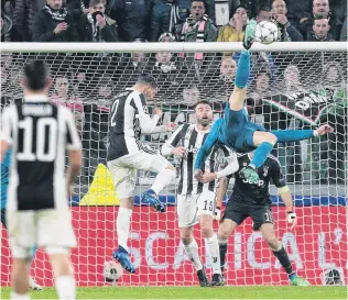  ?? PHOTO: GETTY IMAGES ?? Best foot forward . . . Cristiano Ronaldo of Real Madrid scores his side’s second goal during the UEFA Champions League quarterfin­al match between Juventus and Real Madrid at Allianz Stadium in Turin yesterday.