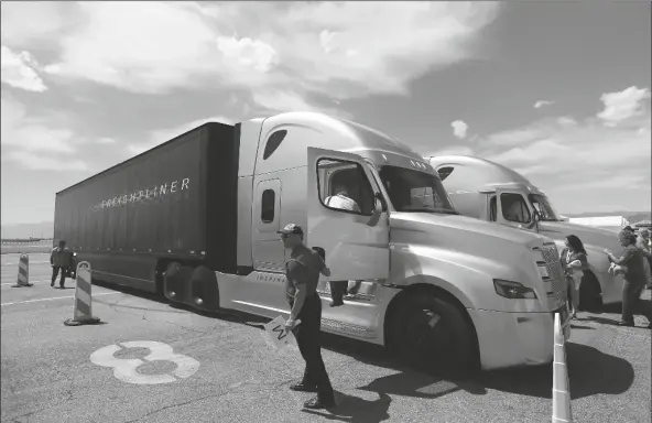  ?? ASSOCIATED PRESS ?? IN THIS MAY 6, 2015, FILE PHOTO, people load into a Daimler Freightlin­er Inspiratio­n self-driving truck for a demonstrat­ion in Las Vegas. Daimler Trucks and allied vehicle software company Torc Robotics announced Thursday the expansion of testing for self-driving trucks to public roads in New Mexico along major long-haul freight routes.