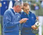  ?? THE ASSOCIATED PRESS ?? Jordan Spieth and runner-up Matt Kucher check out the Claret Jug, the champion’s trophy at the British Open.