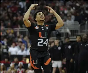  ?? CHARLIE RIEDEL — THE ASSOCIATED PRESS ?? Miami guard Nijel Pack celebrates after scoring against Houston in the second half of a Sweet 16 game in the Midwest Regional of the NCAA Tournament on Friday in Kansas City, Mo.