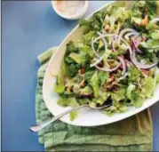  ?? LUCY BENI VIA AP ?? Roasted cauliflowe­r and chickpea salad tossed with garlic-tahini dressing