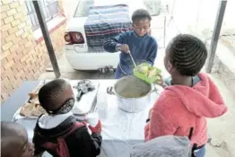  ?? / VELI NHLAPO ?? Bonolo Moahludi, who is 11 years old, has opened a soup kitchen in Alexandra.