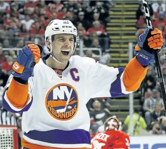  ?? PAUL SANCYA/THE ?? Islanders centre John Tavares celebrates a goal against the Red Wings last week in Detroit.