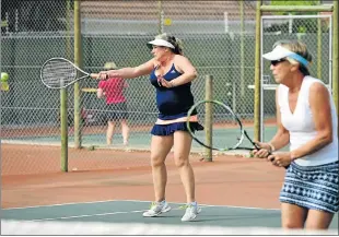  ?? Picture: EUGENE COETZEE ?? WINNING PAIR: Jayne Turner, right, watches as Di Gascoyne returns a forehand during the final of the Wembley Ladies Doubles tennis tournament at Mill Park