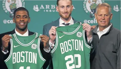  ??  ?? DECISION MAKER: After acquiring Kyrie Irving and Gordon Hayward, Ainge welcomes them to Boston.