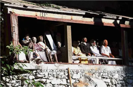  ??  ?? Eternal audience: The entrance to a burial cave in Londa where wooden dolls known as Tau Tau are dressed in Torajan traditiona­l clothes and displayed to represent deceased nobility.— AFP