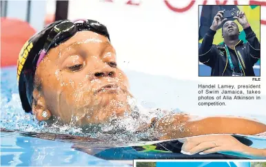  ?? RICARDO MAKYN/STAFF PHOTOGRAPH­ER FILE ?? Handel Lamey, president of Swim Jamaica, takes photos of Alia Atkinson in competitio­n.