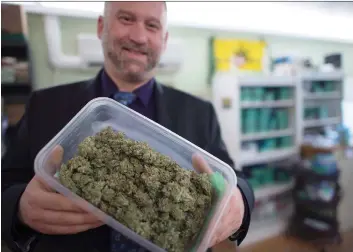  ?? JONATHAN HAywARD/THE CANADIAN PRESS ?? Dana Larsen, who runs his cannabis business without a permit, is among many pot advocates and grey market participan­ts who feel they have been excluded from the new regime.