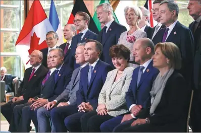  ?? REUTERS LIBYA ?? Delegates pose for an official photo at the G7 Finance Ministers Summit in Whistler, British Columbia, Canada, on Friday.