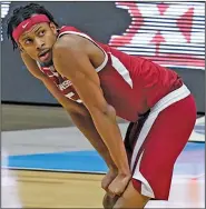  ?? Associated Press ?? Moody headed to the NBA: Arkansas guard Moses Moody (5) looks to the scoreboard during the second half of an Elite Eight game against Baylor in the NCAA men's college basketball tournament last month at Lucas Oil Stadium in Indianapol­is.