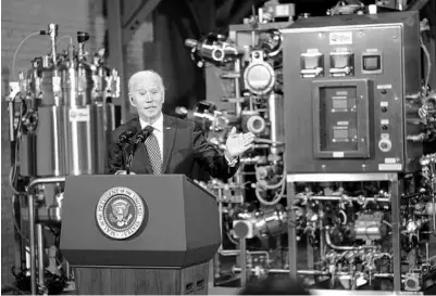  ?? DOUG MILLS/THE NEW YORK TIMES ?? President Joe Biden visits a Pfizer COVID-19 vaccine manufactur­ing site Feb. 19 near Portage, Michigan.