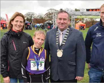  ??  ?? Kevin O’Mahony of D.M.P., a medal winner in the boys’ Under-13 race, with his parents, Martina and Paul, an Chairman of Wexford County Council.