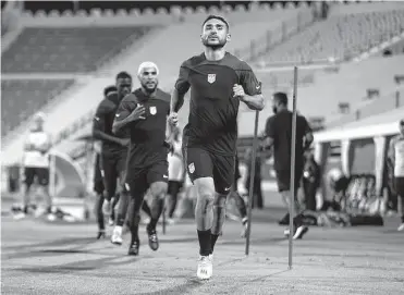  ?? Tim Nwachukwu/getty Images ?? Cristian Roldan of United States warms up during a training session at Al Gharafa SC Stadium on Sunday in Doha, Qatar. The young American team begins play on soccer’s largest stage Monday against Wales.