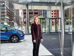  ?? JOE VAUGHN/THE NEW YORK TIMES ?? Mary Barra, CEO of General Motors, with a self-driving Chevrolet Bolt EV at GM headquarte­rs in Detroit on June 2.