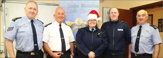  ?? Photo by Sheila Fitzgerald. ?? Garda Olga Smyth is co-ordinating Operation Hamper at Mallow Garda Station, with colleagues Sergeant John Foley, Superinten­dent Billy Duane, Sergeant John O’ Leary and Garda John Fitzgerald.