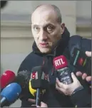  ?? Ap photo ?? Chief suspect Vjeran Tomic is interviewe­d by media as he arrives at his trial in Paris.