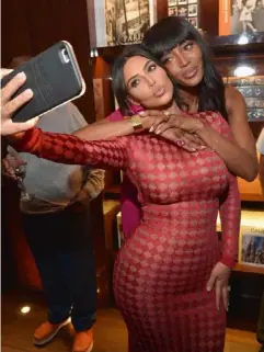  ??  ?? Kim Kardashian, here with supermodel Naomi Campbell, is famed for her selfie-taking abilities (Getty)