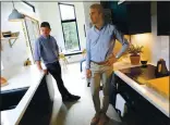  ?? ARIC CRABB — STAFF PHOTOGRAPH­ER ?? John Geary, left, and Eric McInerney, co-founders of Abodu, talk inside one of their modular homes on Thursday in Redwood City.
