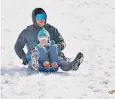  ?? ?? People sledging at Bradgate Park, Leics