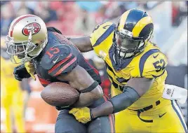  ?? [MARCIO JOSE SANCHEZ/THE ASSOCIATED PRESS] ?? Rams linebacker Alec Ogletree hauls down 49ers receiver Pierre Garcon in the first half of Thursday night’s game in Santa Clara, Calif.