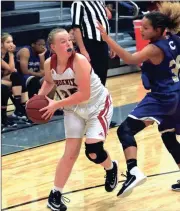  ?? LARRY GREESON / For the Calhoun Times ?? Red Bud’s Taylor Steele (left) looks to pass around a Cartersvil­le player during last Thursday’s game.