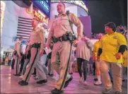  ?? Patrick Connolly ?? Las Vegas Review-journal @Pconnpie Metropolit­an Police Department officers and others walk in the Take Back the Las Vegas Strip event Friday.
