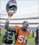  ?? JOE MAHONEY/ THE ASSOCIATED PRESS ?? Broncos linebacker Von Miller walks triumphant­ly off the field after a 3420 victory over the Colts on Sunday at Denver. Miller had three sacks and a forced fumble that helped seal the win.