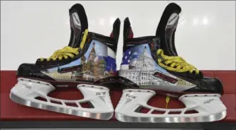  ?? NICK WASS, THE ASSOCIATED PRESS ?? Custom skates made for Alex Ovechkin adorned with designs of the U.S. Capitol, right, and Moscow’s St. Basil’s Cathedral.