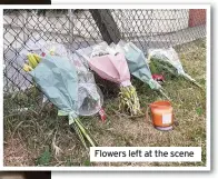  ??  ?? Flowers left at the scene