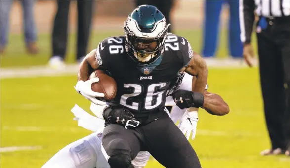  ?? CHRIS SZAGOLA/AP ?? The Eagles hope to get another big game from running back Miles Sanders (26) Sunday at Arizona.