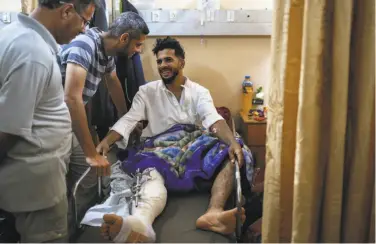  ?? Hosam Salem / New York Times ?? A wounded man rests at Gaza City’s Shifa hospital, where doctors treated hundreds of gunshot injuries.