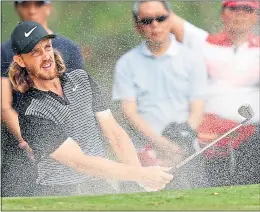  ??  ?? Tommy Fleetwood splashes out of sand in Hong Kong yesterday