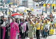  ?? Picture: EUGENE COETZEE ?? UNITED AGAINST ABUSE: A large group of protesters, led by religious leaders, ANC Women’s League members and MECs, marched to the Port Elizabeth High Court in October