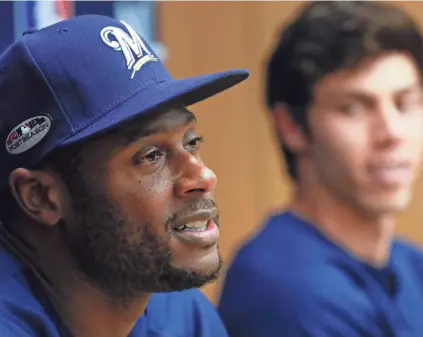  ?? ASSOCIATED PRESS ?? Lorenzo Cain and Christian Yelich answer questions during a news conference at Miller Park on Wednesday afternoon. Both players helped lead the Brewers to a National League Central Division title this season.