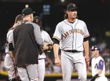  ?? Associated Press ?? San Francisco Giants starter Jeff Samardzija, right, is pulled from the game by manager Bruce Bochy during the sixth inning of Thursday night’s game against the Arizona Diamondbac­ks in Phoenix.