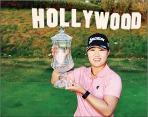  ?? AFP ?? Nasa Hataoka of Japan poses for photos with DIO Implant LA Open Trophy after winning in the final round of the DIO Implant LA Open.