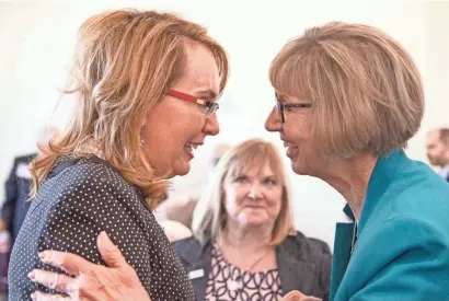 ??  ?? NICKTHE FormerU.S. REPUBLICOZ­A/ Rep. GabrielleG­iffords (left) shares a moment with Pam Simon on Thursday at the Heard Museum in Phoenix where they announced the launch of the Arizona Coalition for Common Sense, a campaign to reduce gun violence.