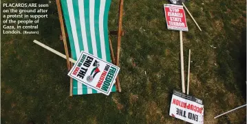  ?? (Reuters) ?? PLACARDS ARE seen on the ground after a protest in support of the people of Gaza, in central London.