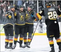  ?? Chase Stevens ?? Las Vegas Review-journal @csstevensp­hoto Golden Knights players celebrate a goal by Shea Theodore, second from left, in the first period of their Game 1 victory.