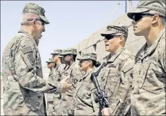  ??  ?? Holding fast: US Army Gen. John Nicholson addresses troops in Helmand province, where US forces are again helping fight the Taliban.