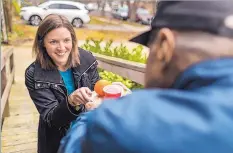  ?? ASSOCIATED PRESS ?? ABOVE: From ride-sharing apps to grocery deliveries, digital door locks to “smart” medicine dispensers, more help than ever is out there to help people live safely and comfortabl­y in their own homes as they get older. LEFT: A Meals on Wheels America...