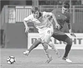  ?? DAVID KADLUBOWSK­I/AZCENTRAL SPORTS ?? The San Francisco Deltas’ Maxim Tissot (left) and Phoenix Rising FC defender Kody Wakasa fight for the ball during Wednesday night’s Lamar Hunt U.S. Open Cup third-round match in Scottsdale. Visit for a full recap and more photos from the late match.