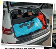  ??  ?? The rear is spacious and easy to access, the boot accommodat­ing