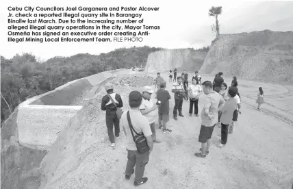  ?? FILE PHOTO ?? Cebu City Councilors Joel Garganera and Pastor Alcover Jr. check a reported illegal quarry site in Barangay Binaliw last March. Due to the increasing number of alleged illegal quarry operations in the city, Mayor Tomas Osmeña has signed an executive...