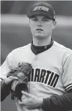  ??  JEFF ROBERSON/THE ASSOCIATED PRESS ?? One-handed Tennessee-Martin pitcher Carter Smith is the No. 1 starter on his team.