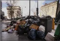  ?? (AP/Thomas Padilla) ?? Uncollecte­d garbage stacks up Tuesday near the Arc de Triomphe in Paris. More photos at arkansason­line.com/315france/.
