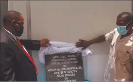  ?? Photo: John Muyamba ?? Get the smart cut… Health minister Dr Kalumbi Shangula unveils the plaque with the help of Kavango East governor Bonifatius Wakudumo on Friday.