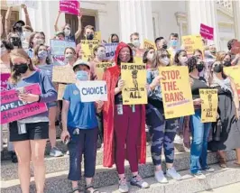  ?? JIM SALTER/AP ?? About 200 abortion rights demonstrat­ors gather for a rally Thursday in St. Louis. Speakers warned that Missouri will likely pursue a restrictiv­e abortion law similar to Texas.